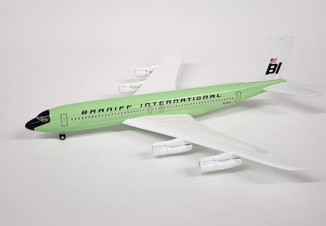 Boeing 707 Braniff International Green die-cast model airplane in brown box packaging.