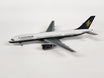 White Boeing 757 die-cast model aircraft in brown box packaging.