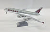 Airbus A380-861 Qatar Airways die-cast model aircraft with display stand.