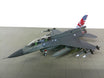 Republic of Singapore Air Force Lockheed F-16D plastic display model on a stand.