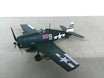 Plastic display model of a Grumman F6F US Navy aircraft with a stand.