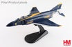 Blue and gold F-4J Phantom II military fighter jet model with display stand and pilot figures.