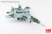 Blue Sukhoi SU-27SM Flanker B fighter jet model with landing gear and display stand.