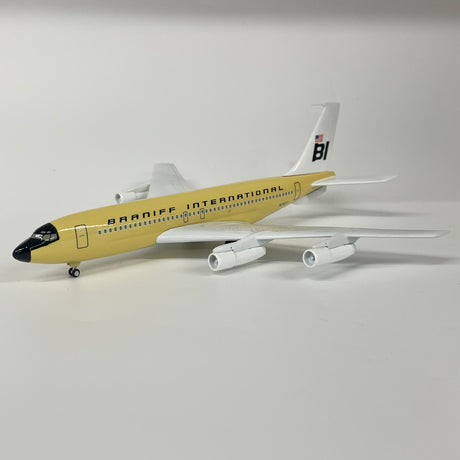 Detailed die-cast Boeing 720 aircraft model in beige with registration marking N7077.