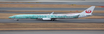 Diecast model Boeing 737-800 aircraft in Japan Transocean Air livery with flaps deployed.