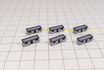 Set of six black and grey plastic 1:400 scale portable cabins for airport dioramas.