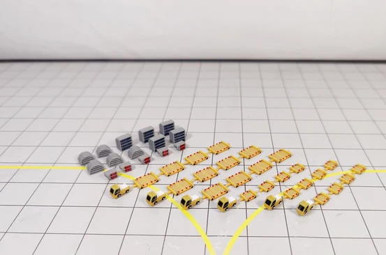 Yellow tug and dolly cargo trailers with ULD containers in 1:400 scale