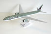 Boeing 777-9X Qatar aircraft model in white and burgundy livery at 1:200 scale.