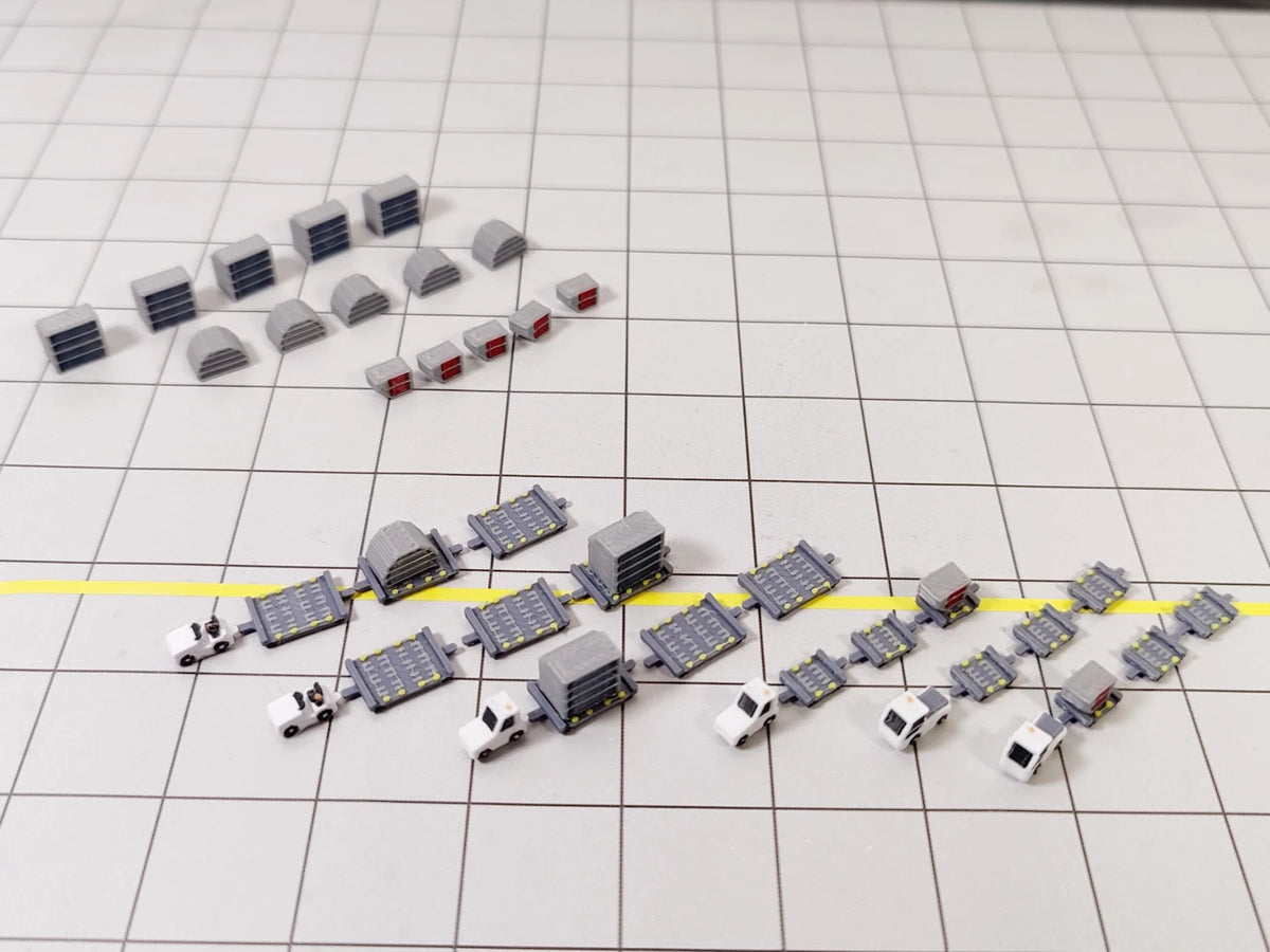 White airport tug and dolly ULD cargo trailer vehicle models in 1:400 scale.