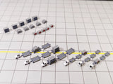 White airport tug and dolly ULD cargo trailer vehicle models in 1:400 scale.