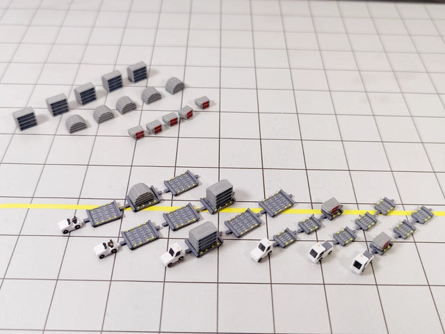 White airport tug and dolly ULD cargo trailer vehicle models in 1:400 scale.