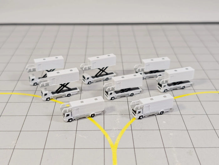 Eight 1:400 scale airport catering trucks for diorama models.